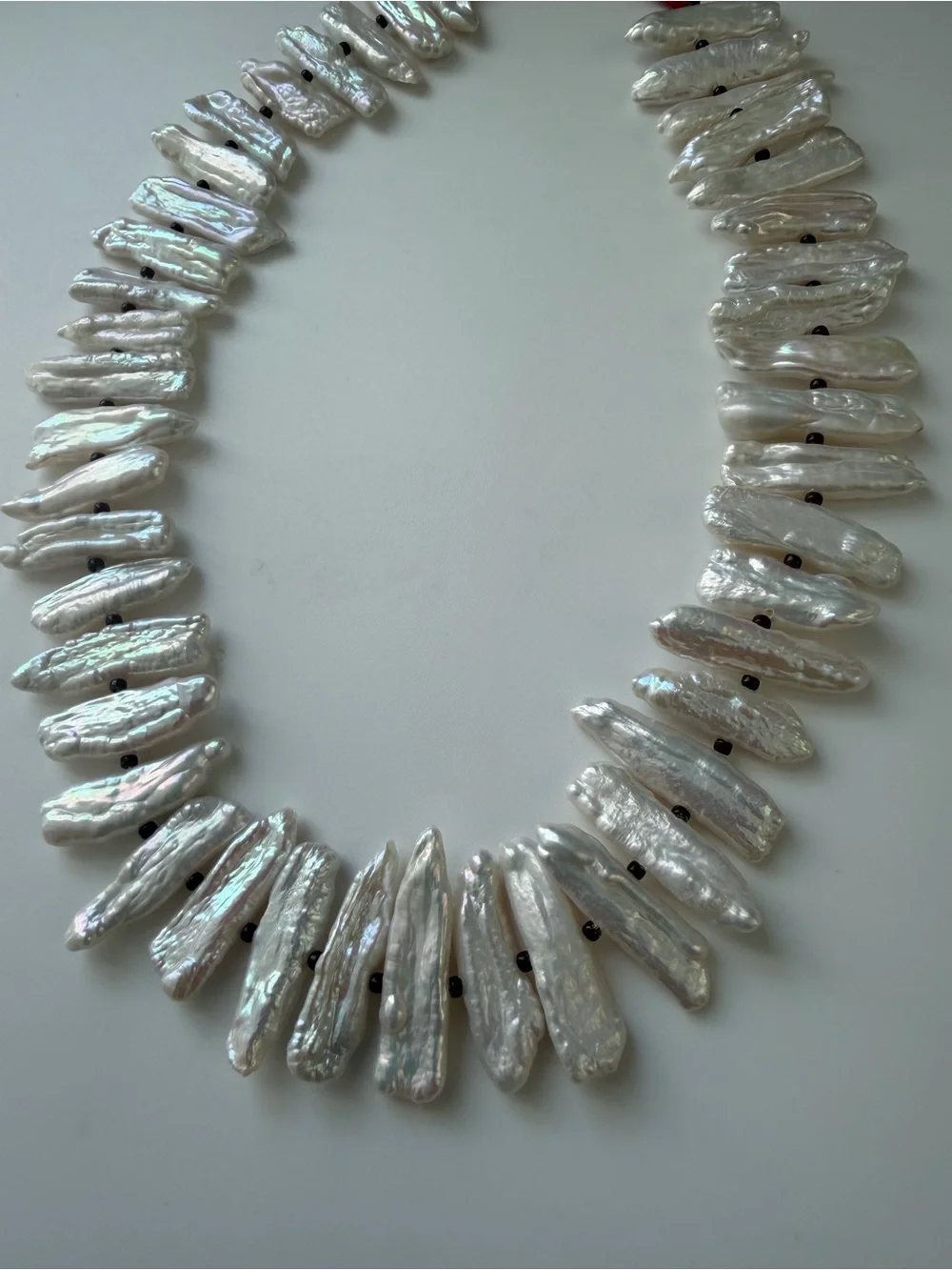 NWOT Roxanne Assoulin White Pearl Spike and Gold Charm Layered Necklace